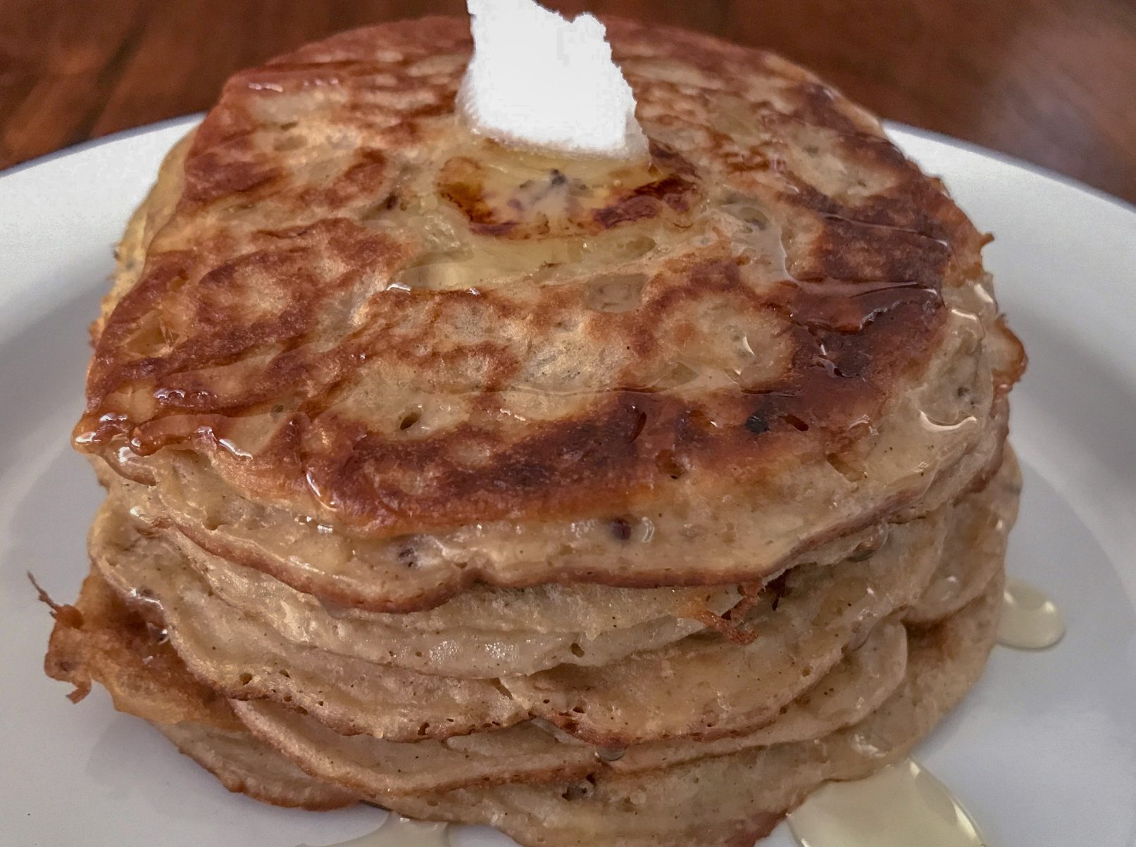 serving 5 banana pancake with coconut oil and pure honey on top